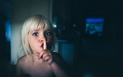 Close-up portrait of girl at home