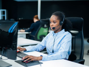 Businesswoman working at desk in office