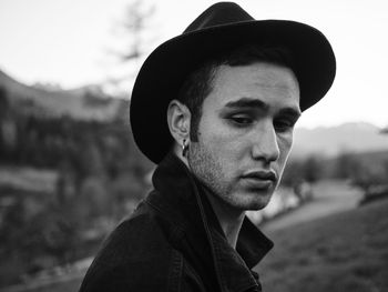 Close-up of young man wearing hat