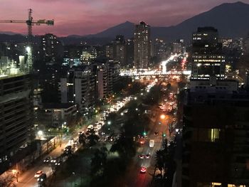 High angle view of illuminated city buildings at night