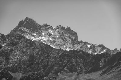 Scenic view of snowcapped mountains against clear sky