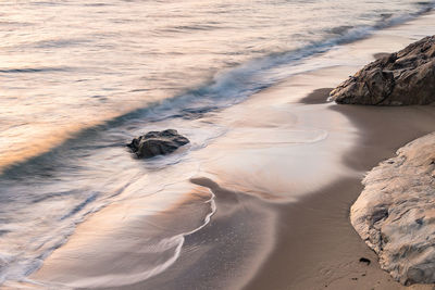 High angle view of beach against sky during sunset