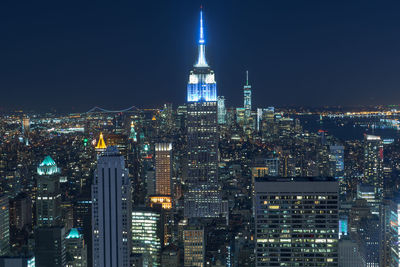 Illuminated buildings in city at night