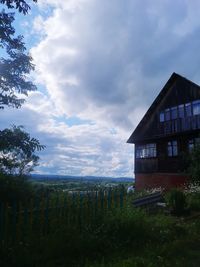 House on field against sky