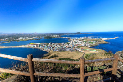 High angle view of sea against blue sky