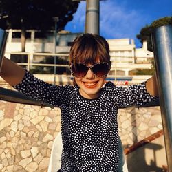 Portrait of happy girl with sunglasses