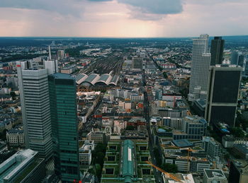 Cityscape against cloudy sky