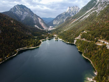 Scenic view of lake and mountains against sky