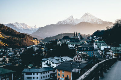 High angle view of townscape and mountains against sky