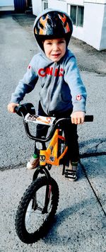 Portrait of boy riding bicycle