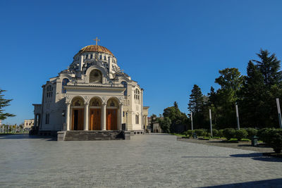 View of historic building against clear blue sky