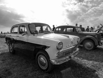 Side view of cars on road