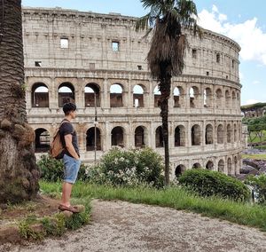 Male tourist at coliseum in rome 