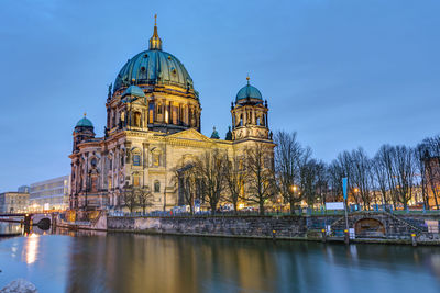 The cathedral of berlin with the river spree at dawn