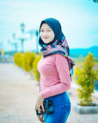 Portrait of woman standing outdoors