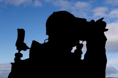 Silhouette of man against sky
