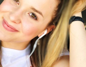 Close-up portrait of smiling young woman