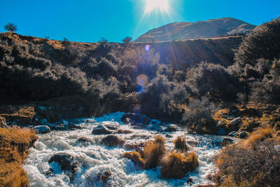 Panoramic view of rocks in mountains against sky