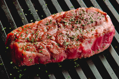 High angle view of meat on barbecue grill