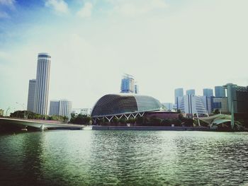 River in city against sky