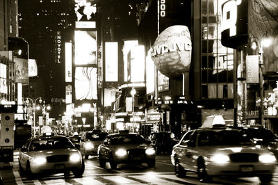 Illuminated city street at night