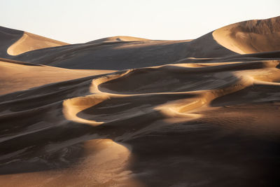 View from nature and landscapes of dasht e lut or sahara desert after the rain with wet sand dunes 