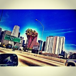 Buildings against clear blue sky