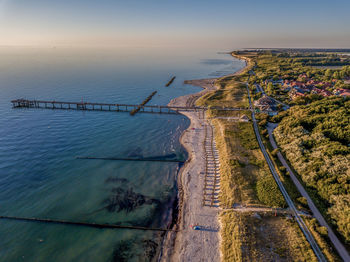 High angle view of beach against sky during sunset