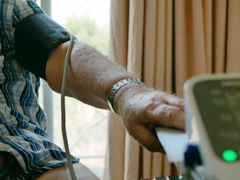 Close-up of man using mobile phone