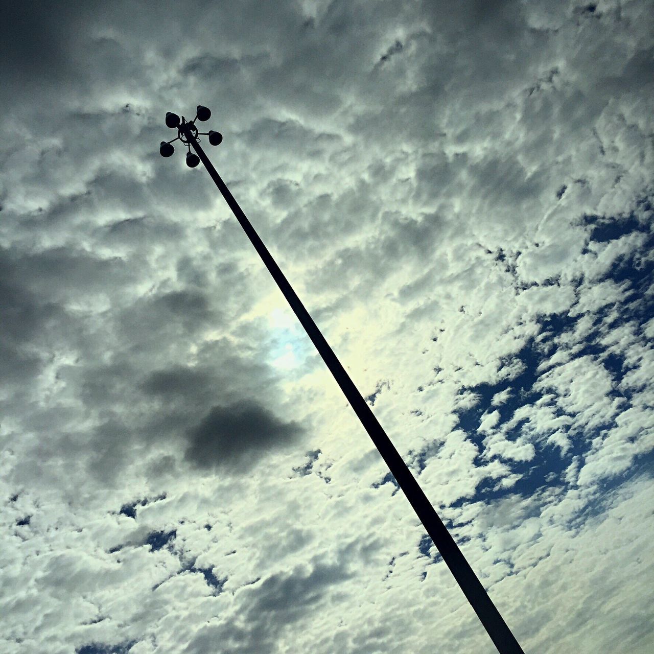 low angle view, sky, cloud - sky, bird, cloudy, power line, cloud, silhouette, cable, electricity, street light, fuel and power generation, animal themes, connection, pole, flock of birds, flying, technology, lighting equipment