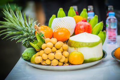 Close-up of fruits in container on table