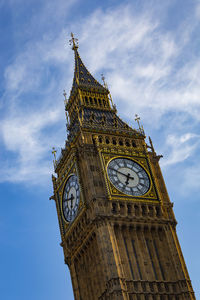 Low angle view of clock tower against sky