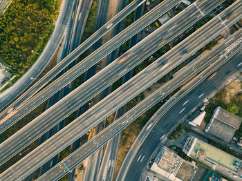 High angle view of street amidst trees in city