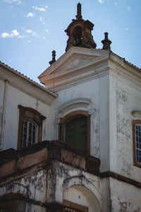 Low angle view of old building against sky