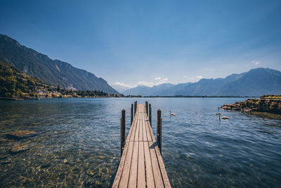 Pier over lake against sky