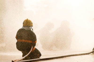 Rear view of people in snow during winter