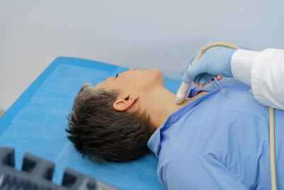 High angle view of woman with iv drip in hospital