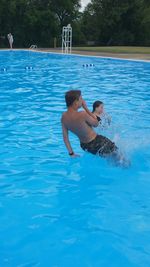 Full length of woman swimming in pool