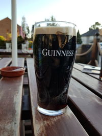 Close-up of beer glass on table