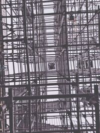 Low angle view of metallic structure against sky