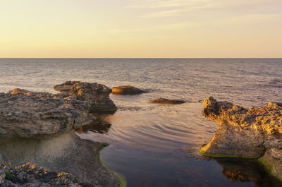 Scenic view of sea against sky during sunset