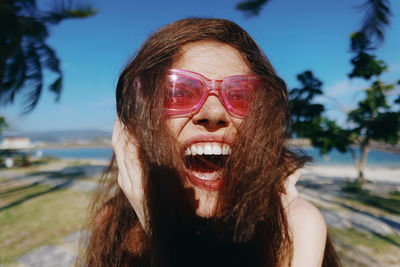 Portrait of young woman wearing sunglasses