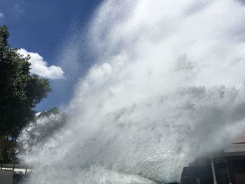 Low angle view of fountain against sky