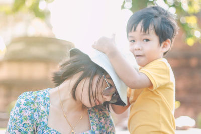 Portrait of mother and daughter outdoors