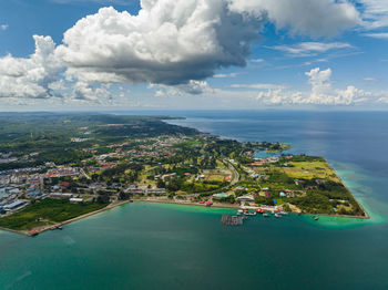 High angle view of sea and buildings against sky