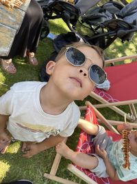 High angle view of siblings looking at camera