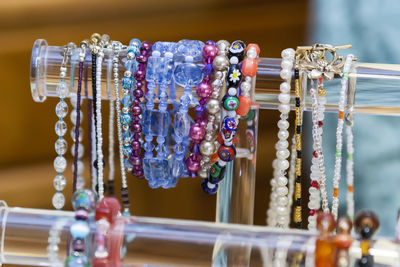 A rack of completed handmade bracelets and necklaces