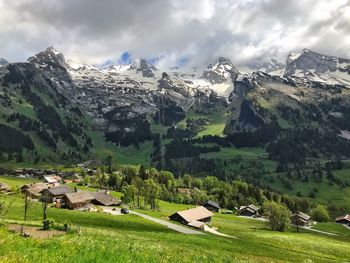 Panoramic view of houses and mountains against sky