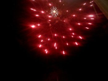 Close-up of firework display over black background