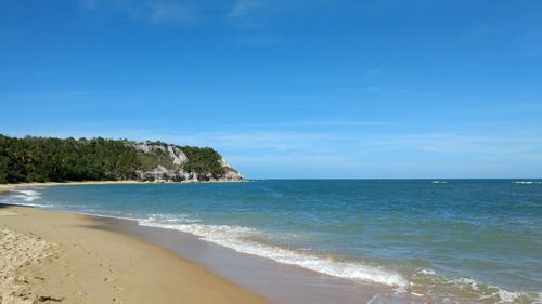 Scenic view of sea against blue sky